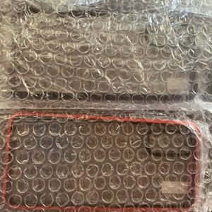 Brand new in package. Black and red or simple red